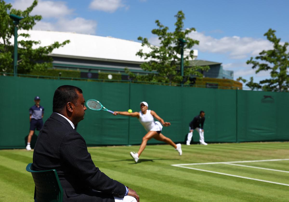 Wimbledon's human touch yields to electronic eyes but officials embrace new role