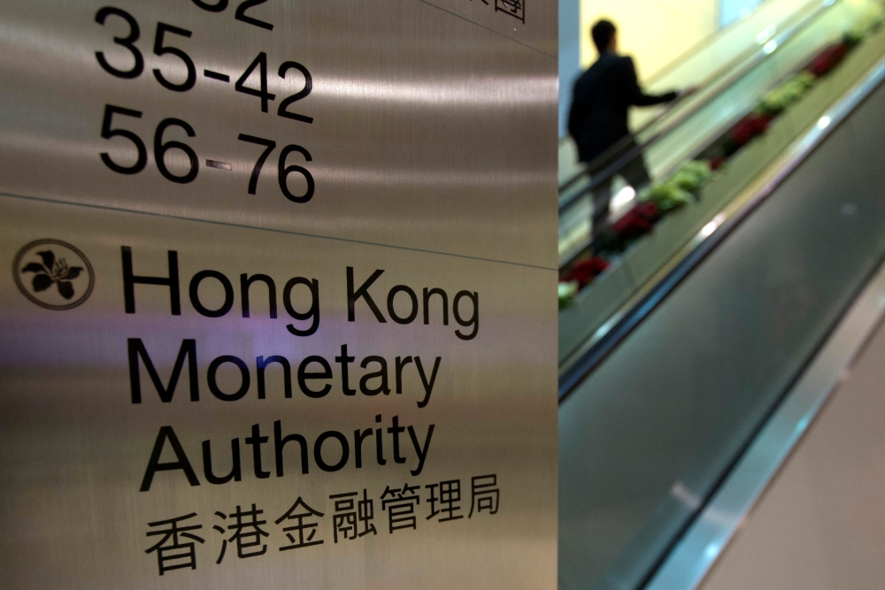 Hong Kong’s de facto central bank steps in as currency hits weak end of trading band