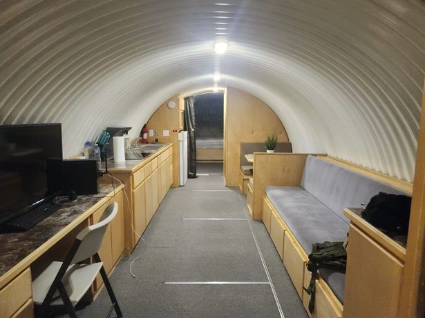 'I live in an underground bunker with blast-proof door and 18 beds - I love it'