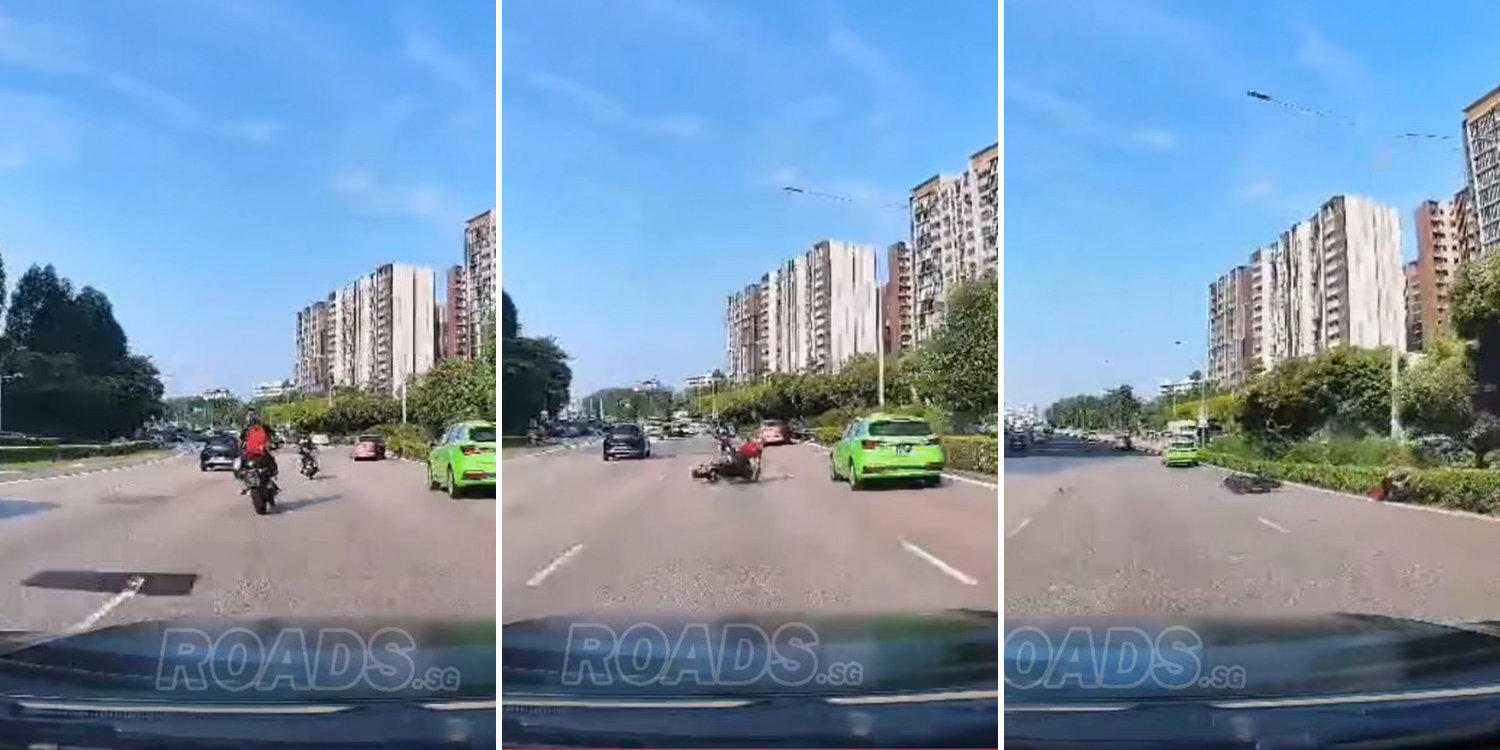 Rider nearly run over by oncoming taxi after falling & skidding on PIE