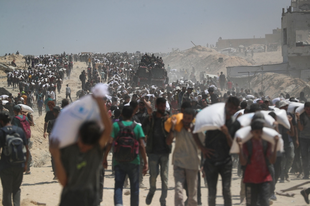 UN races to reach Gaza’s starving as Israel allows limited pause, secure aid routes