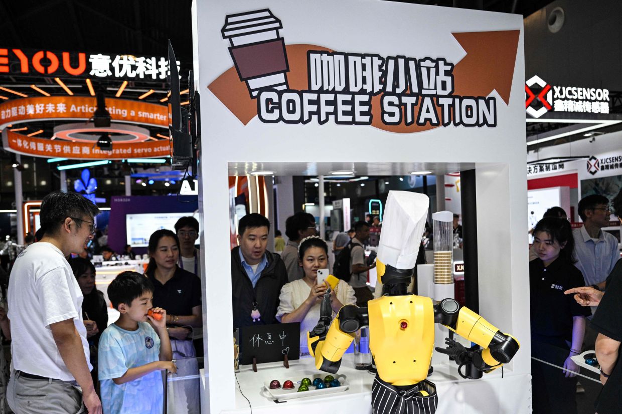 Boxing, backflipping robots rule at China’s biggest AI summit