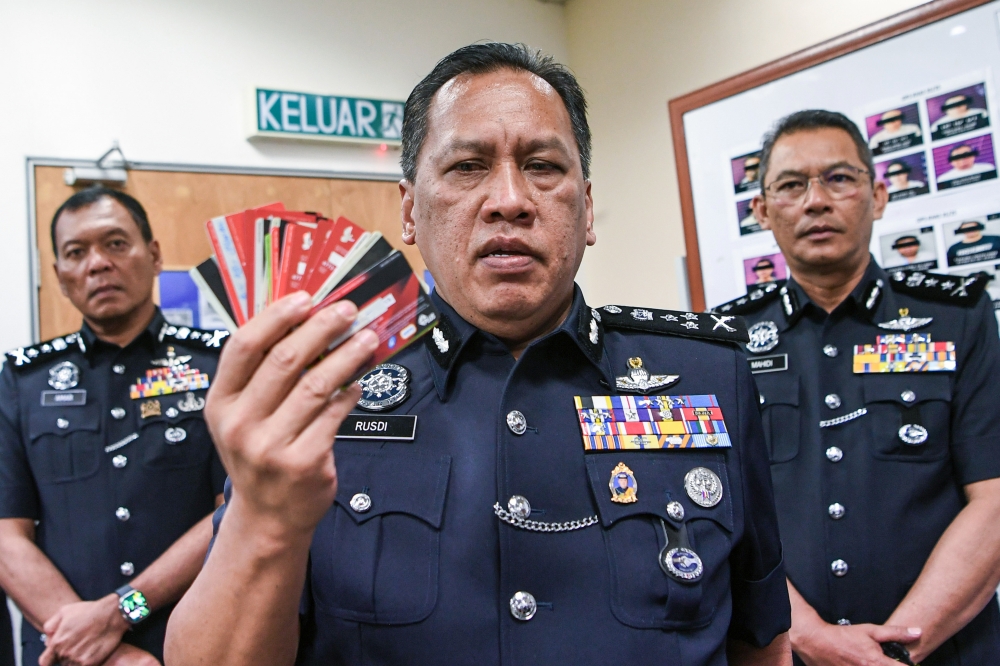 Police arrest 71 in nationwide raids on mule account syndicates, seize nearly 1,000 ATM cards and RM392,000 in cash