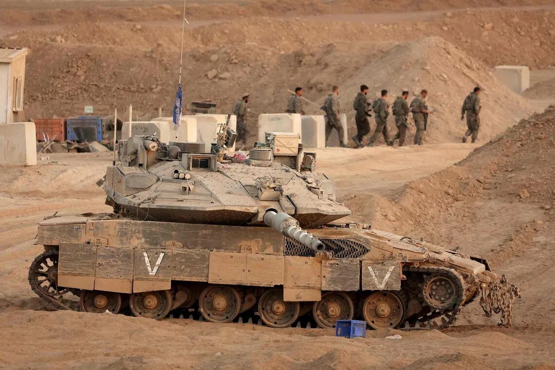 Israeli forces start pulling back from parts of Gaza under ceasefire deal