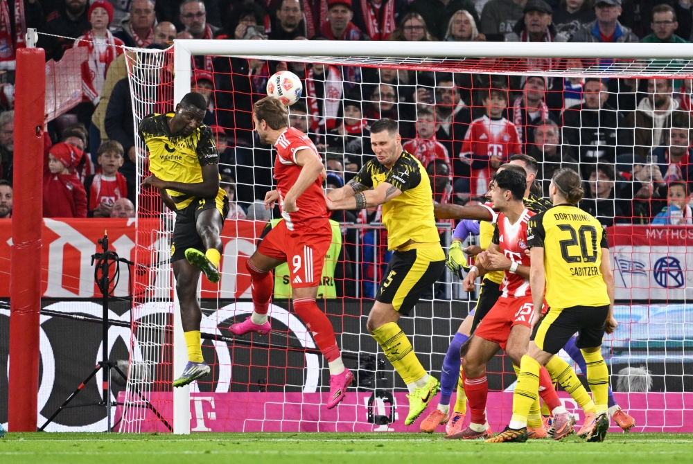 Kane is scorer and provider as Bayern snap Dortmund’s unbeaten run with 2-1 win