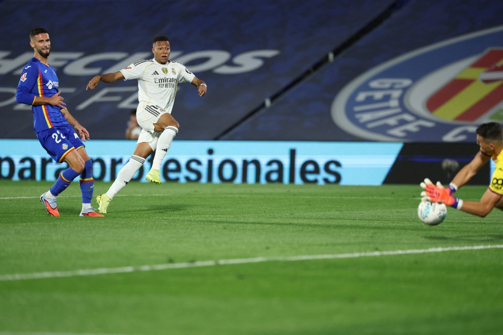 Mbappe fires Real Madrid to La Liga top spot as nine-man Getafe self-destruct