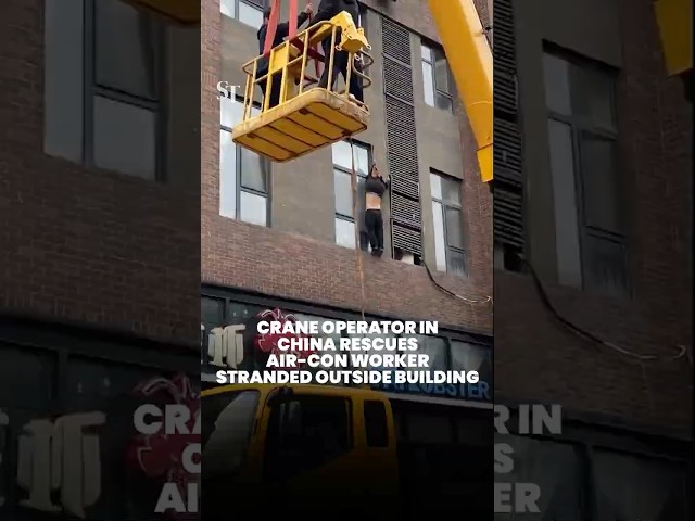 Crane operator in China rescues air-con worker hanging outside building