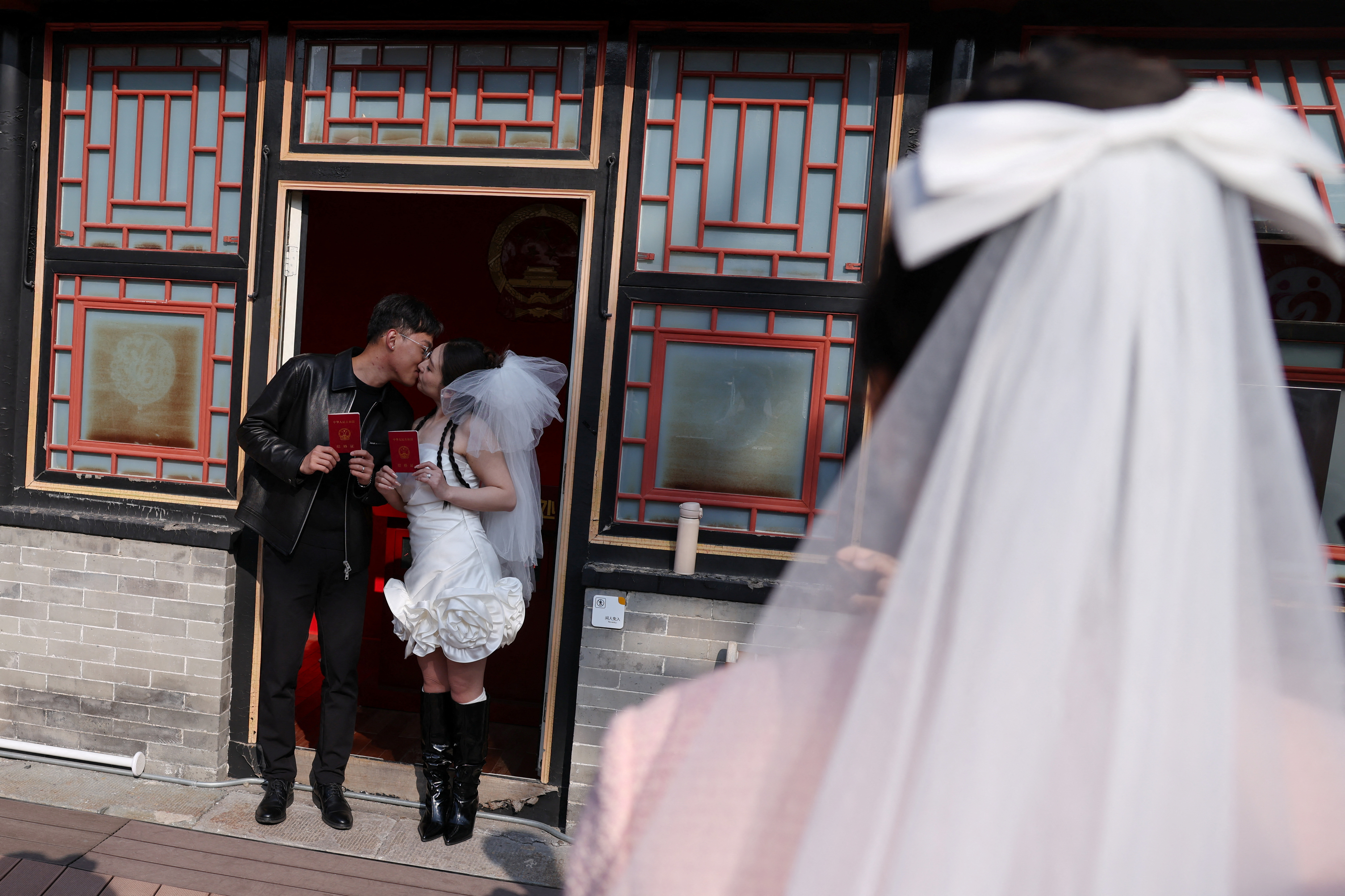 In China, wedding bells are ringing in nightclubs, a subway station and on snowy mountain peaks