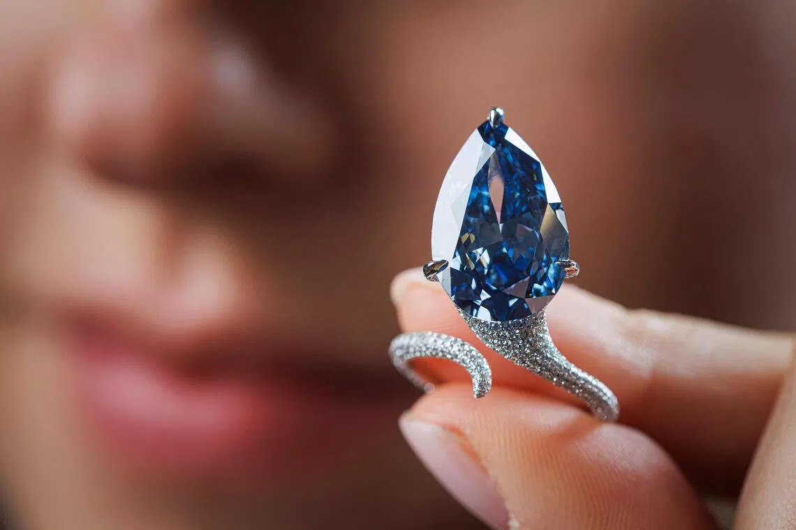 Mellon Blue diamond ring sells for $32m in Geneva auction