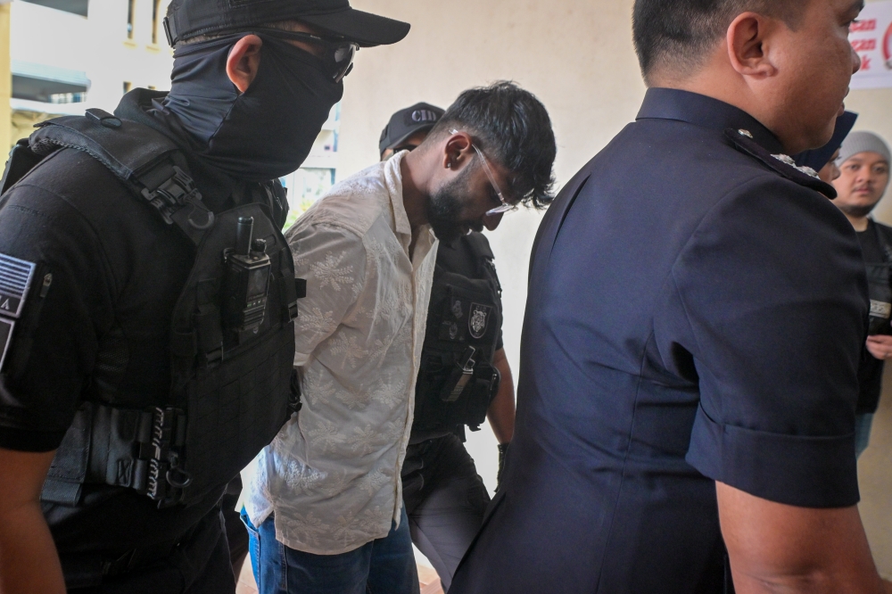 Two men charged with murder of saleswoman found bound and naked near Seri Kembangan roundabout