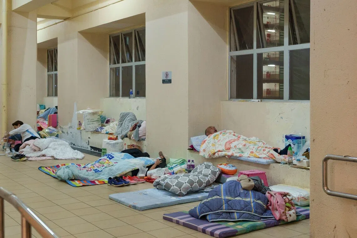 Despairing Hongkongers stranded by fire search for help, answers