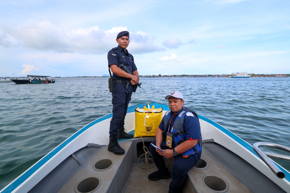Ballot boxes begin arriving at Sabah vote counting centres, some flown in by helicopter from island schools