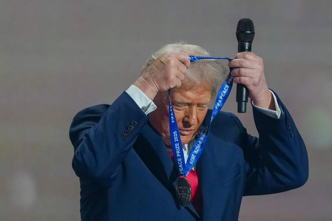 Winning a gold medal for peace and dancing to YMCA: Trump living his best life at World Cup draw