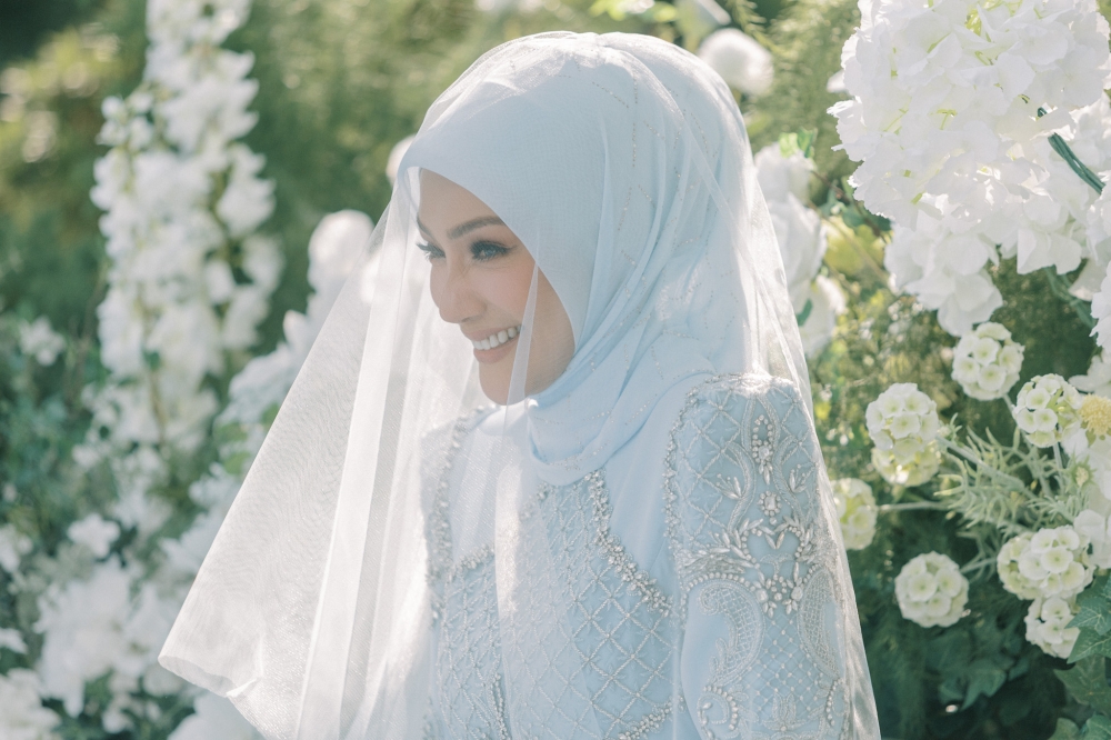 At their wedding, Mr E dismisses ‘trophy wife’ label, describes Erra Fazira as an established career woman