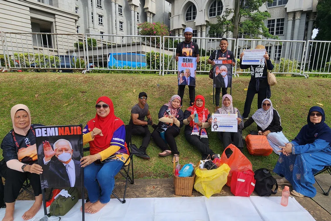 Many cheer, but some disappointed with guilty verdict for Malaysia’s ex-PM Najib