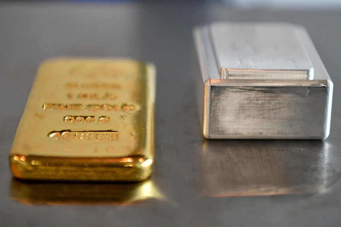 Gold, silver plunge as traders book profit from record rallies