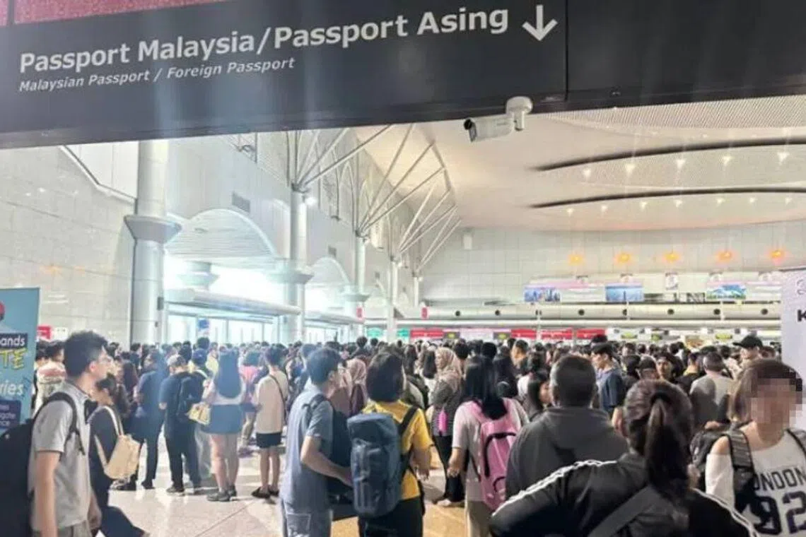 Thousands, including Singaporeans, stranded at land checkpoints in Johor after autogates crash