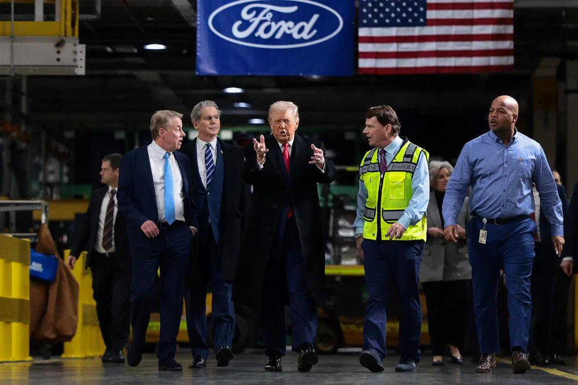 Trump touts economic record during Detroit trip, seeking to ease voter anxieties