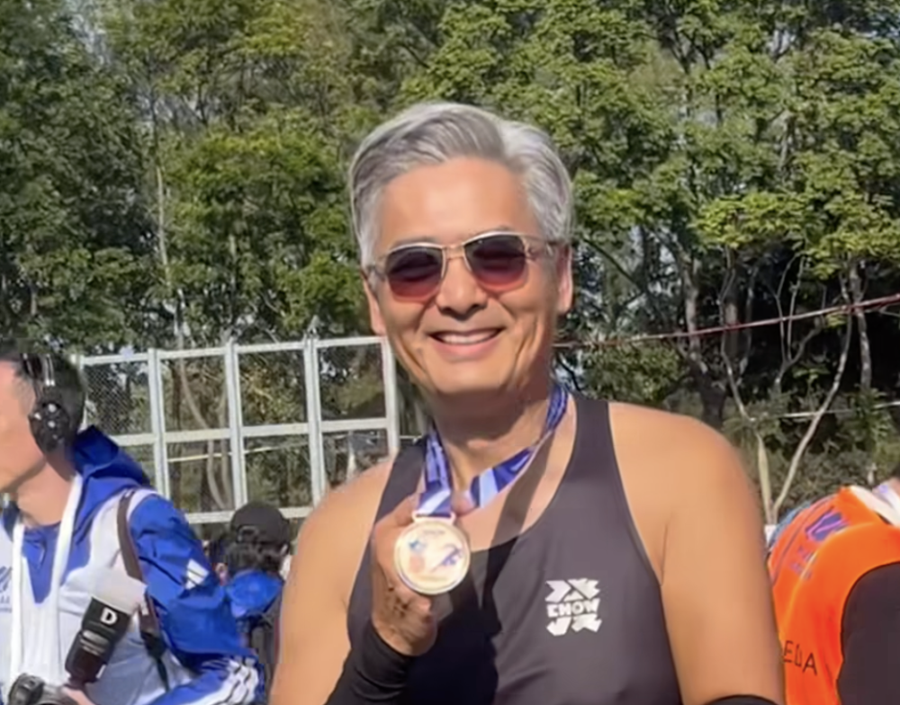 Still running the show: Chow Yun-fat, 70, crosses HK Marathon 10km line to ‘God of Gamblers’ theme song