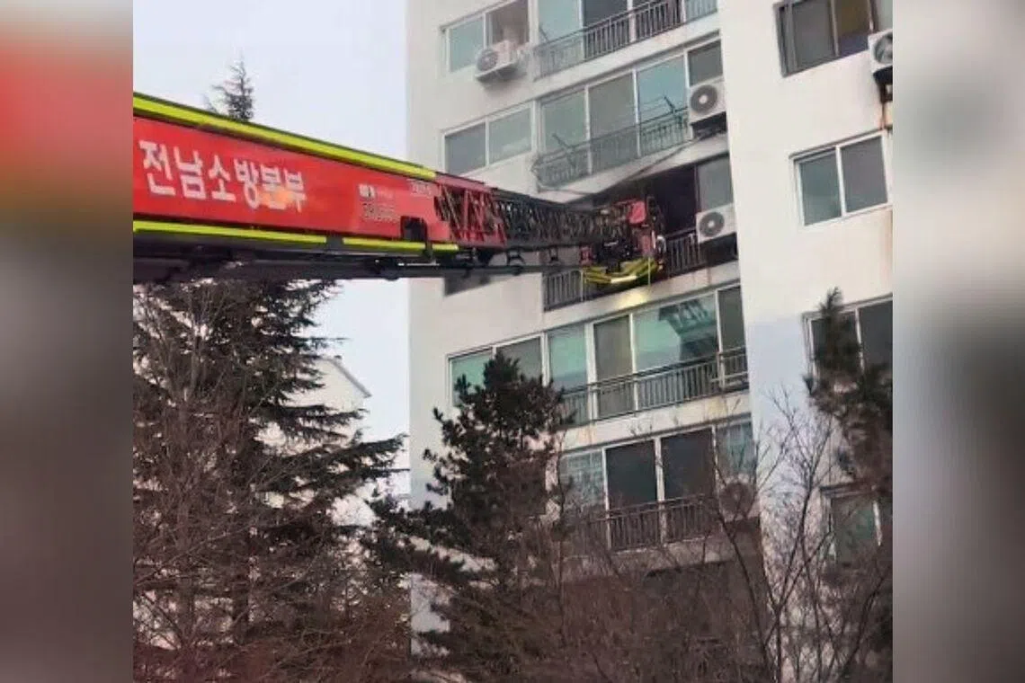 Mother climbs down wall of building to rescue kids from burning home in South Korea