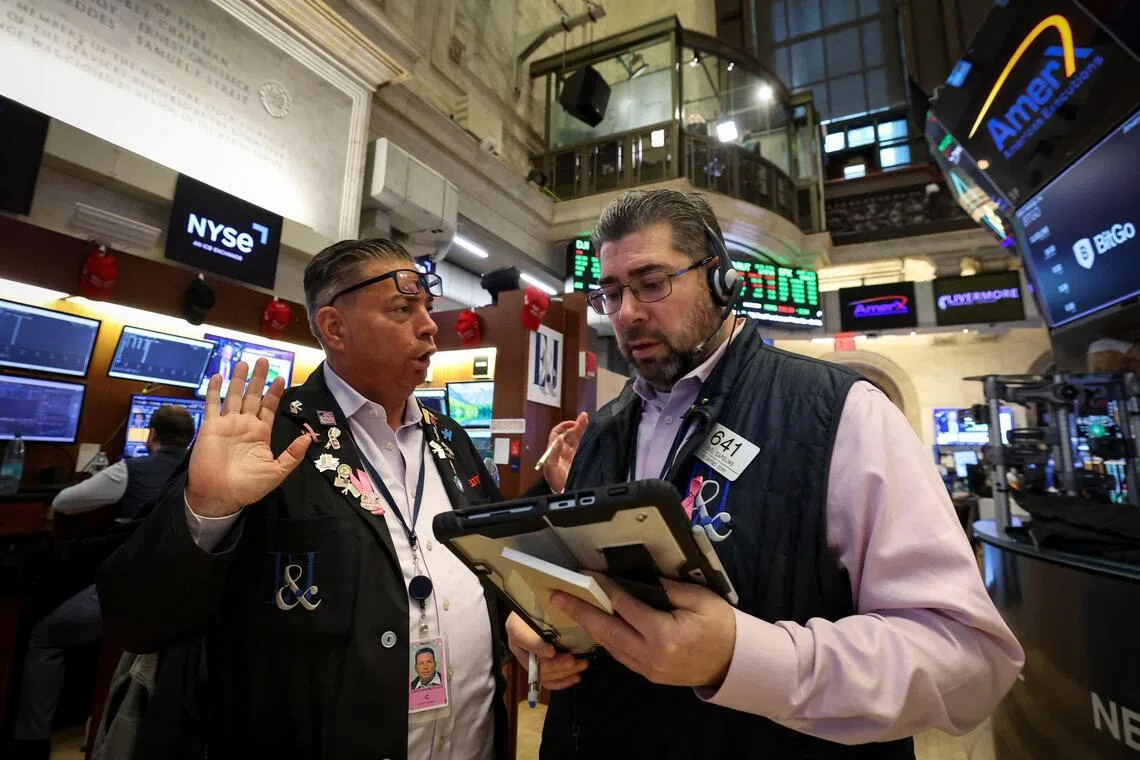 Wall Street ends up as investors buoyed by tariff relief, upbeat data
