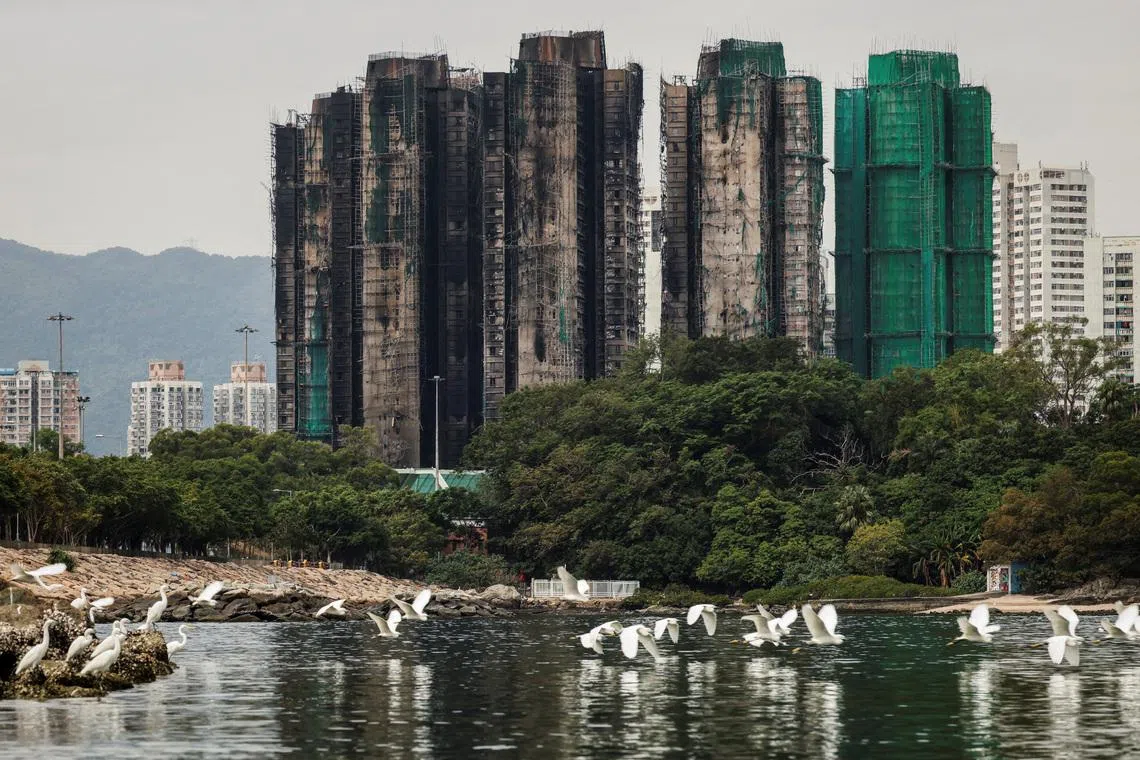 Hong Kong plans to buy homes devastated in deadly high-rise fire