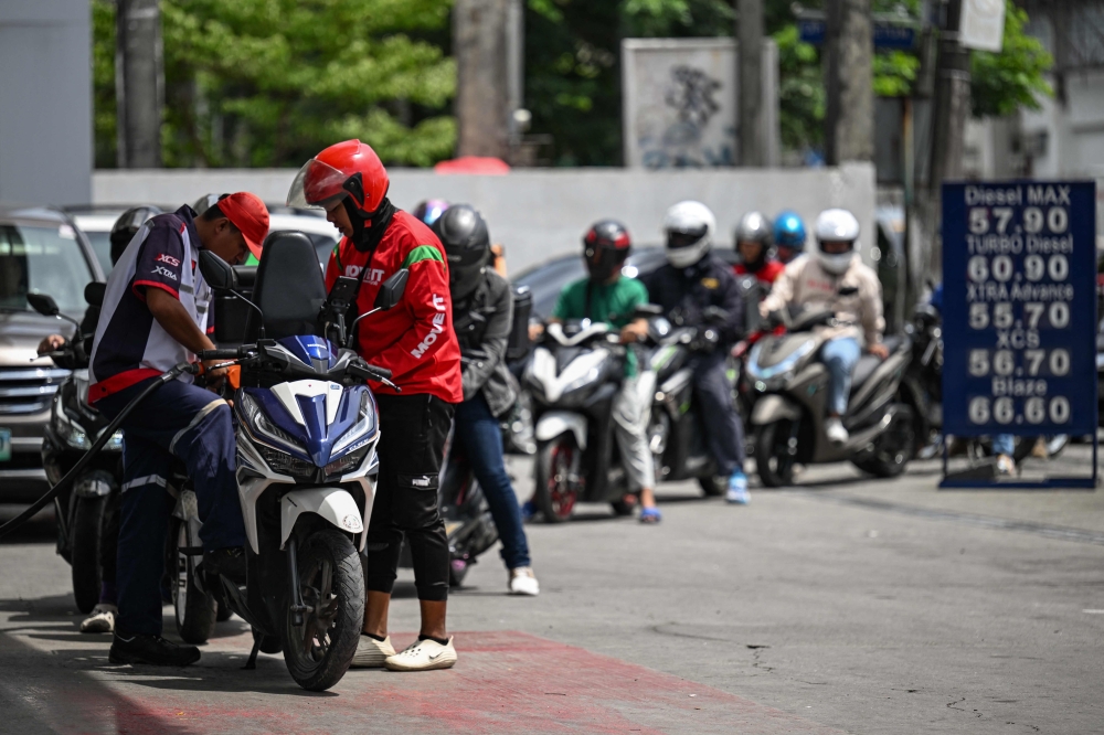 Philippine motorists queue at petrol stations as war-driven fuel price hike looms