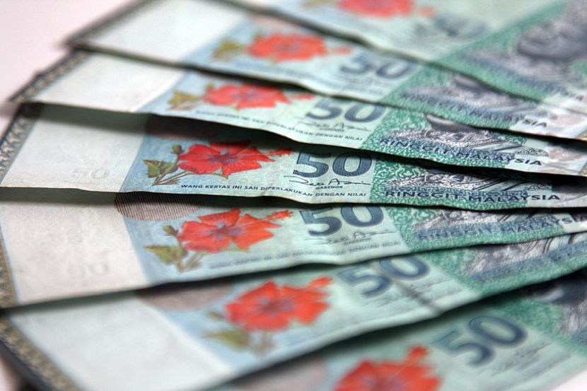 Ringgit opens easier against US$, firmer against majors