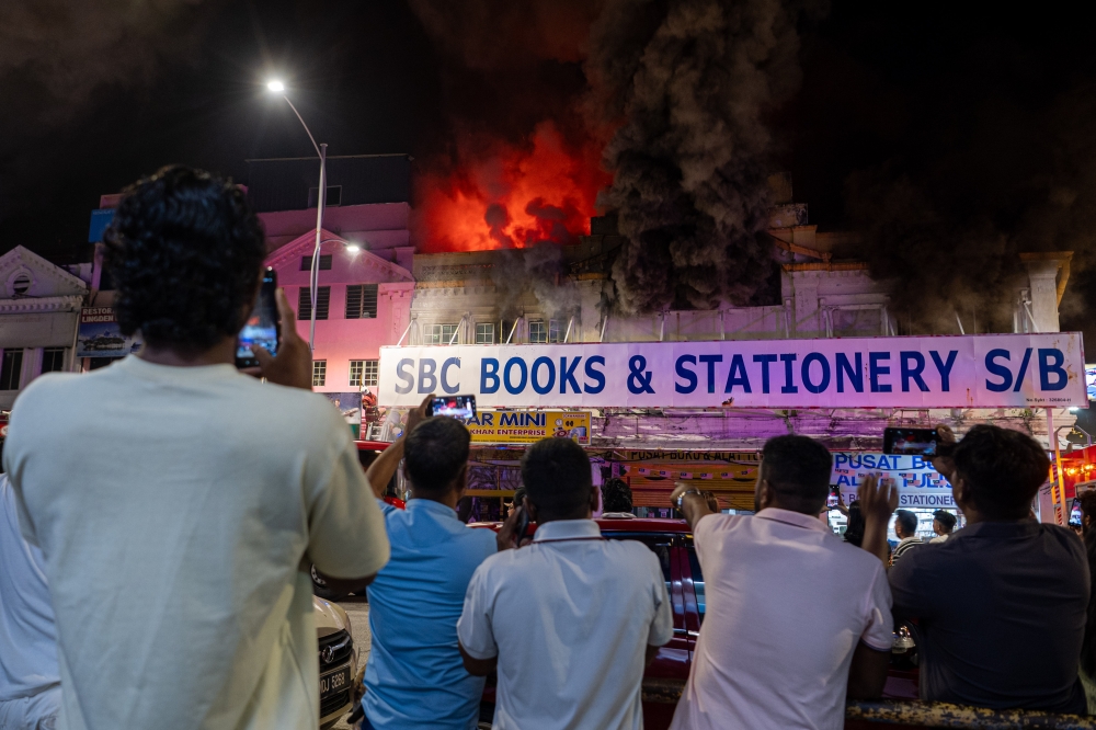 Firefighters battle bookshop inferno and hillside forest fire in Seremban, no injuries reported